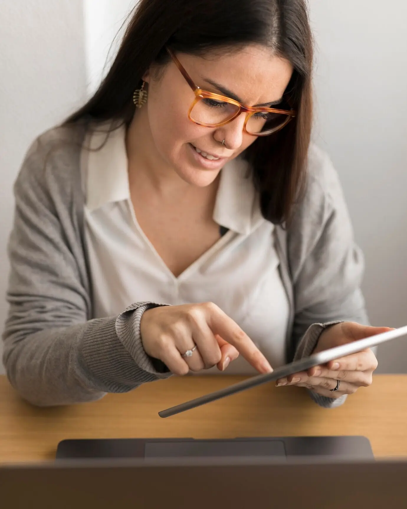 A woman working from home on a tablet