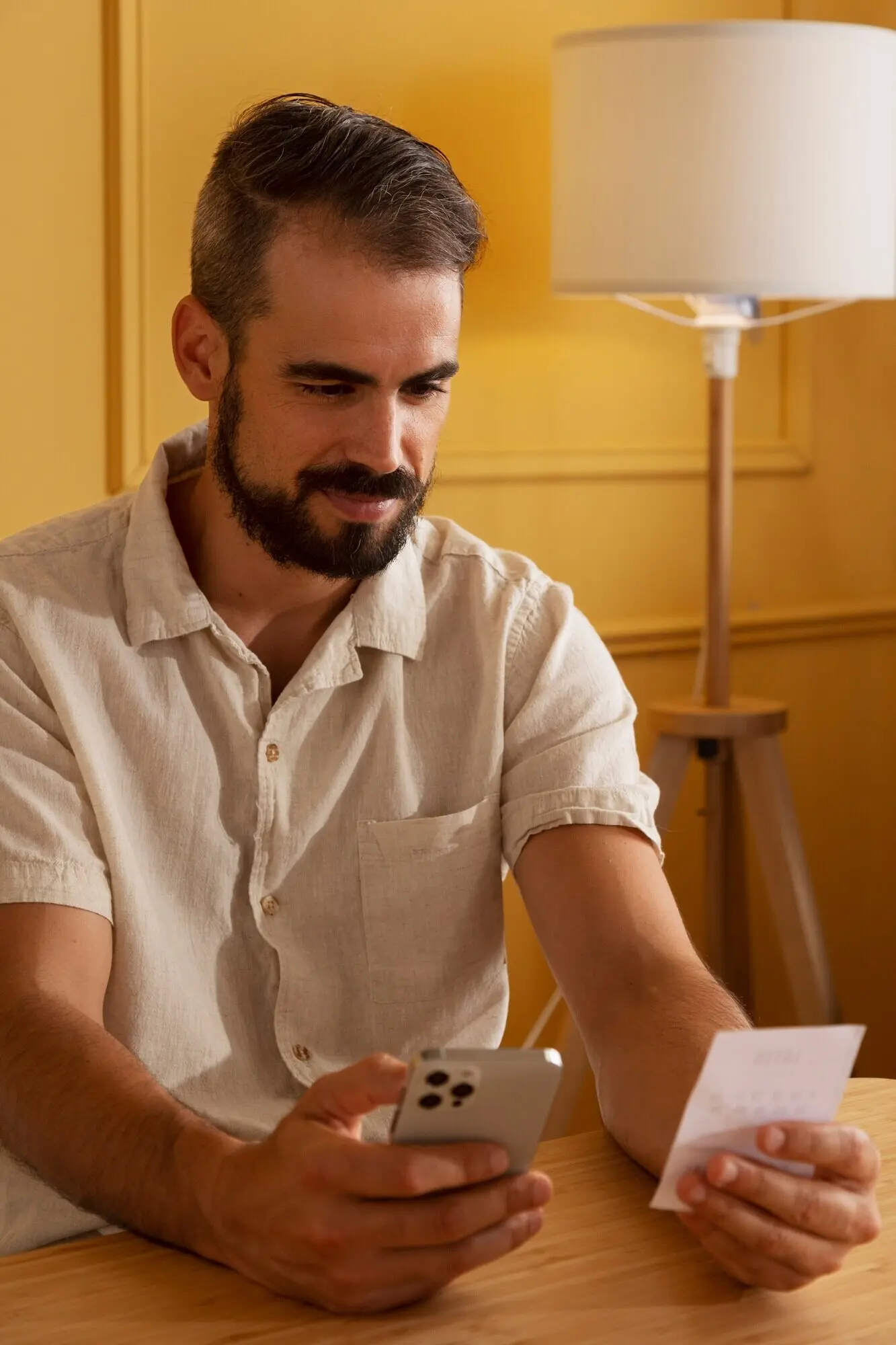 A medium shot of a man holding a lottery ticket.